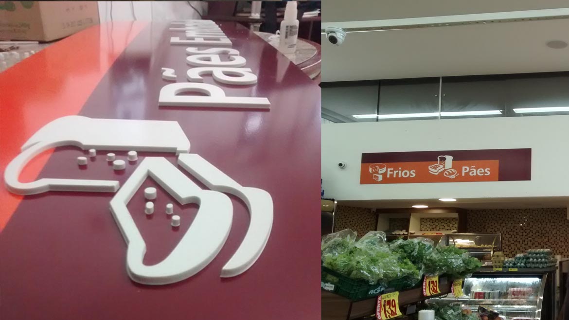 Placas de sinalização do Mercado Donatti com letras recortadas em acrílico branco